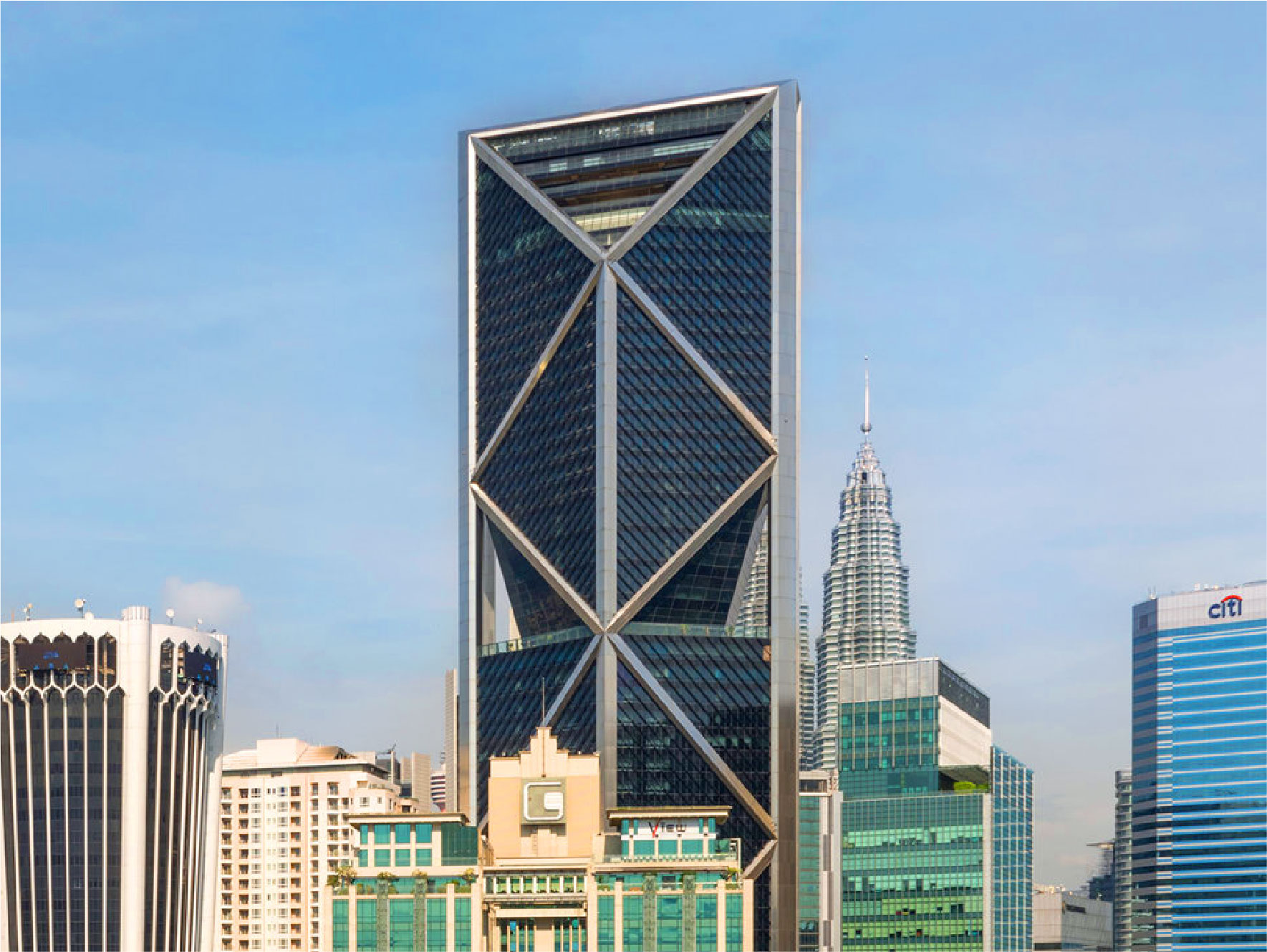 Ilham Tower with striking curtain wall design and aluminum cladding systems in Kuala Lumpur skyline.